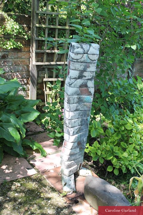 Contemporary sculpture in a New Vintage garden
