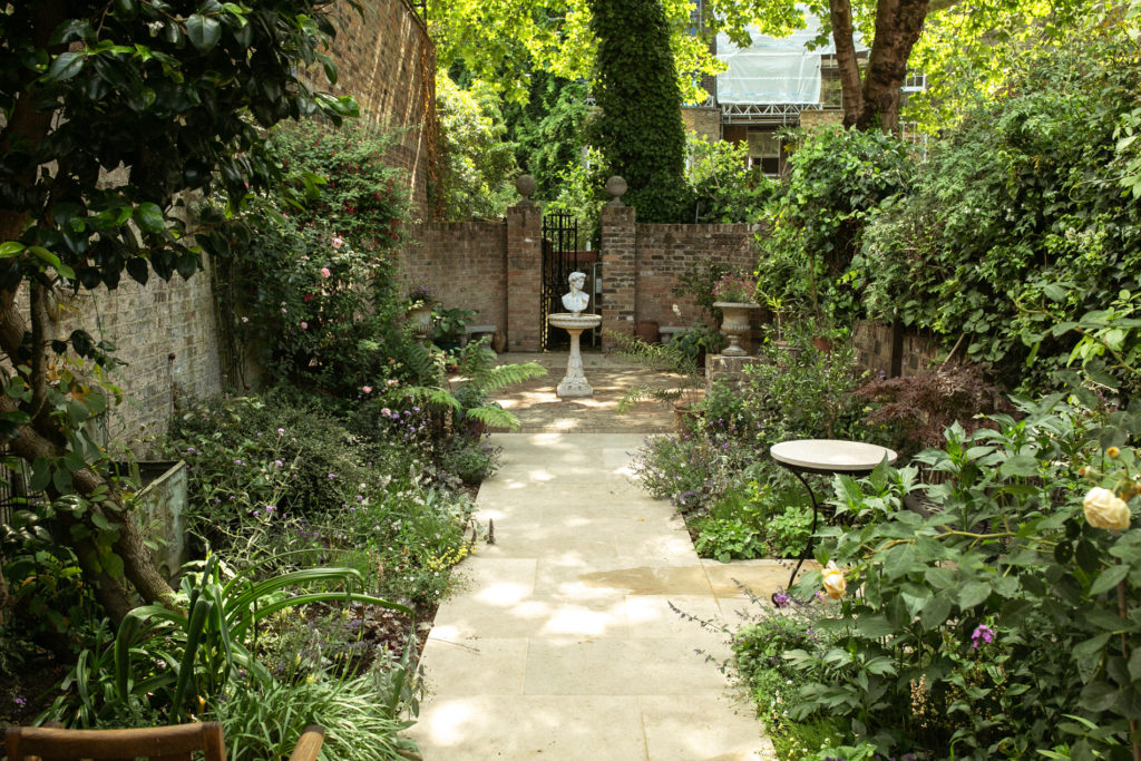 Path leading to seating area at the bottom of the garden